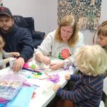 Children, parents and grandparents at the Jamerson Memorial Library Toddler Story and Craft Time working on Crafts.