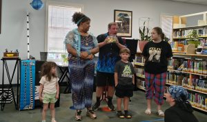The Amazing Mr. B and some participants in the magic show